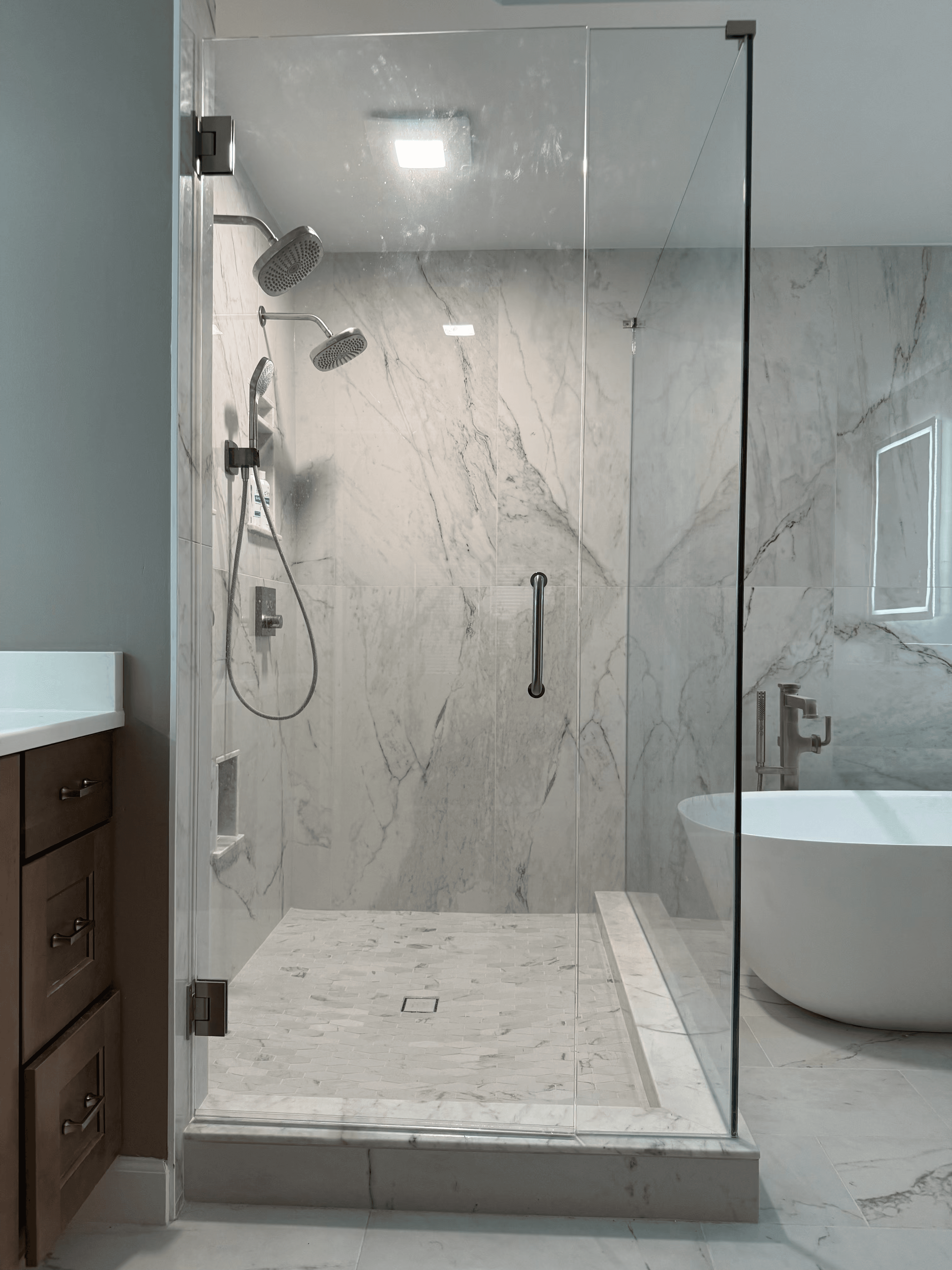 Walk-in shower with modern tile and built-in bench